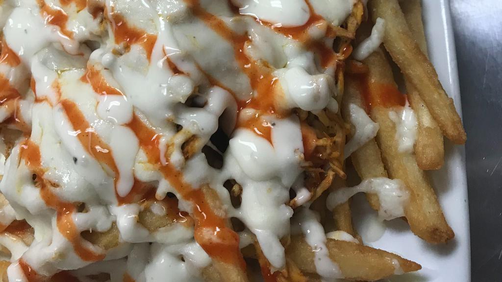 Buffalo Chicken Fries · Fries with chicken breast tossed with buffalo sauce, melted cheese and drizzled with blue cheese dressing