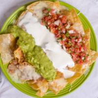 Super Nachos · Your choice of meat, beans, sour cream, guacamole, melted cheese, and pico de gallo salsa. S...