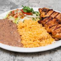 Grilled Chicken Plate · Grilled chicken served with rice, beans and tortillas.