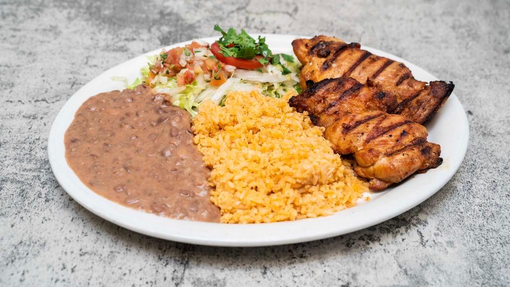 Grilled Chicken Plate · Grilled chicken served with rice, beans and tortillas.