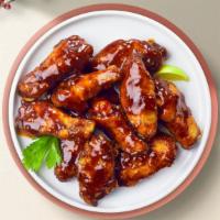 Sit By The Roast Wings  · Fresh chicken wings breaded, fried until golden brown, and tossed in barbecue sauce. Served ...