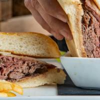 Roast Beef Dip  · oven roasted beef, swiss & roasted garlic toasted hoagie with our house au jus.
