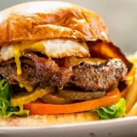 The Local Burger · ½ lb. patty served with mayo, lettuce, mild cheddar, tomatoes, pickles, and a sunny side up ...