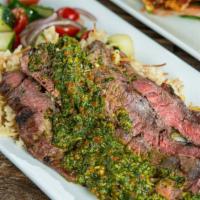 Chimichurri Steak · 8 oz skirt steak glazed with our house made chimichurri sauce served with a cilantro lime ri...