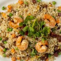 Com Chien Duongchau / Combination Fried Rice · Shrimp, Chinese roast pork (char siu) Chinese sausage (lap cheong), egy carrots, peas,& jasm...