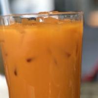 Trà Thái Trân Châu / Thai Tea (With Or Without Boba) · Thai milk tea on ice with chewy balls of tapioca; a strong black tea,
flavored with star ani...