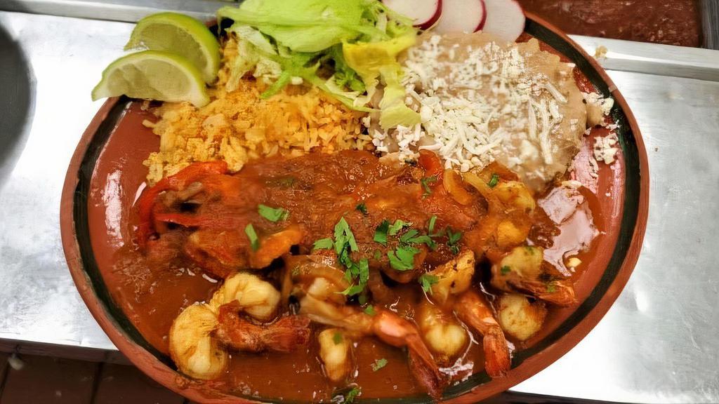 Camarones Rancheros · Rice,beans,shrimp,ranchero sauce,onions,bell peppers