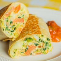 Veggie Breakfast Burrito · Scrambled eggs, sautéed mushrooms, spinach, grilled onions, diced tomato, avocado, and melte...