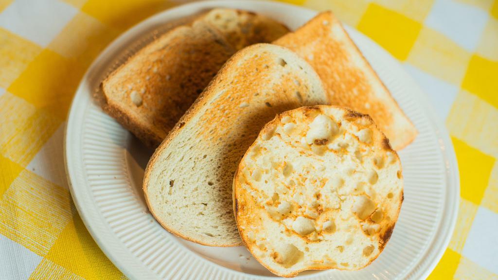 Toast (2 Pieces)  · Two pieces of toast, your choice of bread (Rye or White). Choice of spreads on the side.
