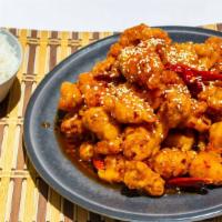 Sesame Chicken · Chunks of chicken with garlic wine surrounded by broccoli florets and topped with sesame see...