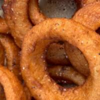 Onion Rings · Sweetened buttermilk rings fried to crunchy perfection, served with ranch dressing.