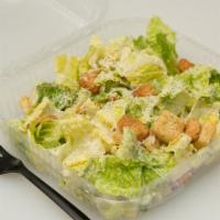 Caesar Salad · Romaine Heart, Croutons and Parmesan Cheese tossed with Caesar Dressing.