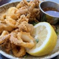 Crispy Calamari · Seasoned calamari strips, served with our Thai chili dipping sauce.