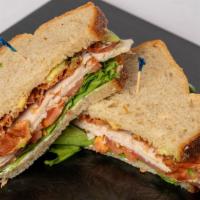 Turkey Club Sandwich · On Country French with Mayonnaise, Lettuce, Tomato, Turkey, Avocado and Bacon.