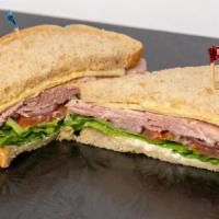 Ham Sandwich · On Sour Dough with Dijon Mustard, Mayonnaise Lettuce, Tomato, Red Onion, Ham and Swiss Cheese.