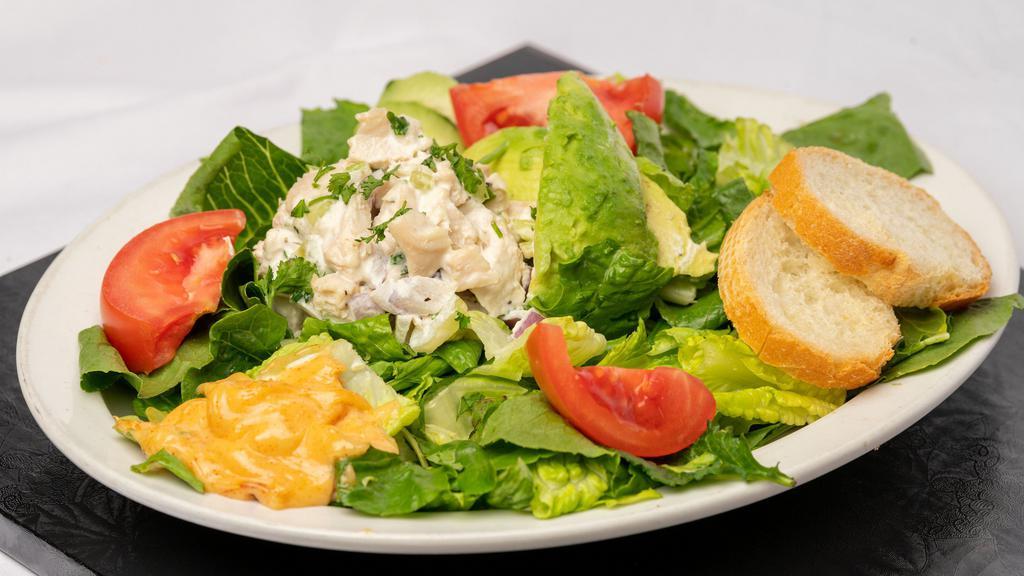 Avocado Chicken Salad · Mixed Greens with Chicken Salad in Half of an Avocado with Dijon Vinaigrette Dressing.