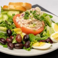 Nicoise Salad · On a Tomato Crown with Tuna served with Homemade Potato Salad, Kalamata Olives, Hard boiled ...