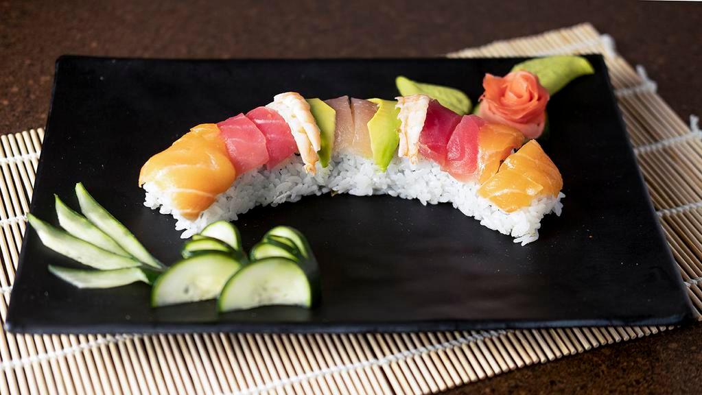 Rainbow Roll · (kani, avo) assorted raw fish.