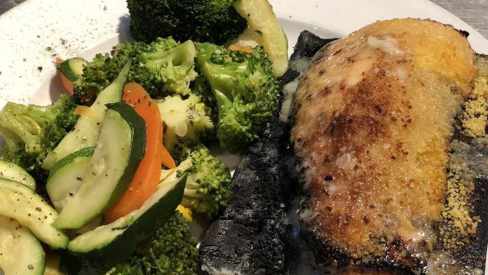 Cedar Plank Salmon · Salmon crusted with Citrus Seasoning, Broiled on a Cedar Plank topped with a Orange Citrus Butter.  Served with Vegetables and Wild Rice.