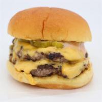 Double Cheeseburger · Hand formed and flat top grilled with onions. All come served with American cheese, pickles,...