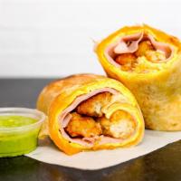 Ham, Egg, And Cheddar Breakfast Burrito · 3 fresh cracked, cage-free scrambled eggs, melted Cheddar cheese, sliced ham, and crispy pot...