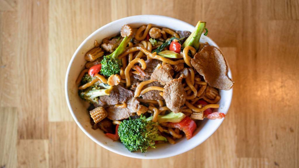 Stir Crazy · sauteed house made noodles, thinly sliced beef and pork, bell peppers, baby corn, broccoli, and baby bok choy. Seasoned with house sauces. Includes a pork potsticker