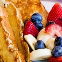 French Toast · Two pieces of Brioche, dipped in Egg batter, spiced with Cinnamon and Vanilla, topped with s...
