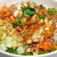 Spicy Nomnam Bowl · Green Leaf Lettuce, Rice Noodles, Basil, Cucumber, Pickled Carrot and Daikon, Nut Mix, Cilan...