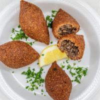 Kibbeh Balls W/Meat · Hand Made and Deliciuos - Bulgur & meat shells, stuffed w/ ground beef, pine nuts, onion & s...