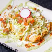Chicken Taquitos · Three taquitos, shredded lettuce, pico, cotija, Mexican crema, avocado crema, taquito red sa...