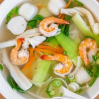 Seafood Noodle Soup · Crab, squid, fish ball, bok choy, and shrimp.