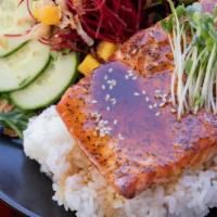 Baked Salmon Teriyaki · Baked salmon steak, served with a small salad and white rice.