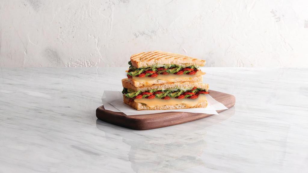 Tuscan Grilled Cheese (V) · For a limited time only! Provolone, basil, spinach, oven-roasted tomato, pesto* aioli, grilled sourdough . *contains nuts