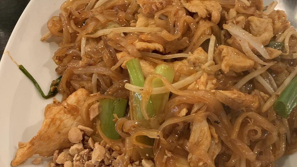 C-Pad Thai Noodle · Thai noodle cooked with egg, bean sprout, green onion and crushed peanut with choice of meat. Served with spring roll, fried wonton, fried shrimp, steamed rice and includes chicken tom kha soup or salad.