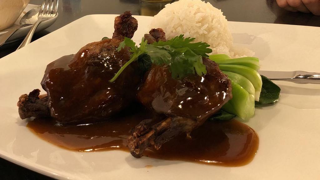 Duck Tamarind · Aromatic duck leg served with bok choy and tamarind sauce. Served with a scoop of steamed jasmine rice.