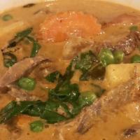 Roasted Duck Curry · Roasted duck cooked in red curry paste, coconut milk, tomato, pineapple, pea and Thai basil ...