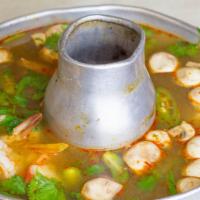 Tom Yum · Thai spicy lemongrass soup with mushrooms.
