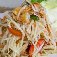 Papaya Salad · Shredded green papaya, tomato green bean, ground peanuts and seared shrimp tossed in a spicy...