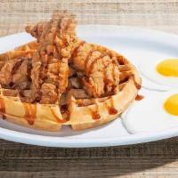 Chicken & Waffle · Three crispy breaded chicken tenders drizzled with bourbon sauce on a Belgian waffle served ...