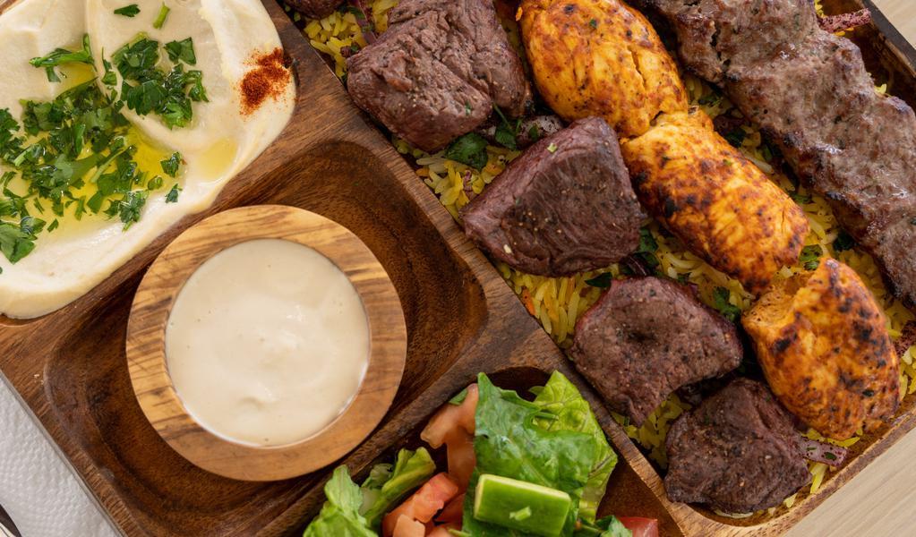 Mixed Kabob Plate · One skewer of beef kabob, One skewer of chicken kabob, one skewer of Koofta kabob, Served with Rice, Pita Bread, and your option of 2 cold appetizers.