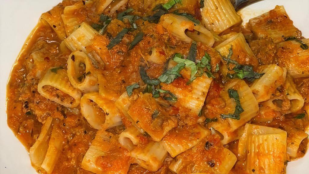 Rigatoni Bolognese · Our classic meat sauce slow cooked with beef, pork, veal and Italian sausage.