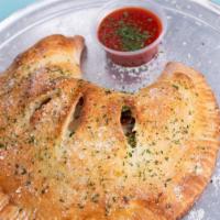 Calzone · Crescent moon turnover with three kinds of cheese and your choice of any three toppings.