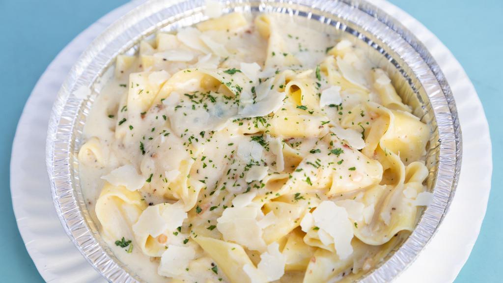Pappardelle Alfredo · Pappardelle with a roasted garlic cream sauce.