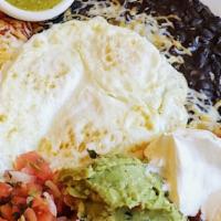 Huevos Rancheros · Gluten-free. 3-Egg huevos rancheros with seasoned black beans & corn tortillas, and a chicke...