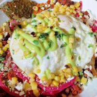 Marmalade Spicy Chilaquiles · Corn tortillas quick cooked in chipotle chile sauce, topped with queso fresco, chorizo, cila...