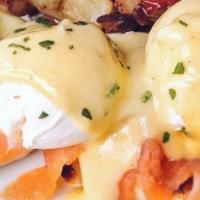 Smoked Salmon Benedict · Oak smoked salmon layered on a toasted English muffin with 3 poached eggs and hollandaise. C...