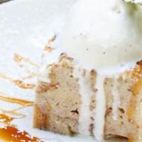 Warm Bread Pudding · Vanilla and brandy flavored with raisins and warm caramel sauce, served with vanilla bean ic...