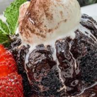 Molten Chocolate Cake · Dense chocolate cake with a molten truffle center, warm with vanilla bean ice cream.