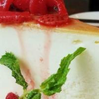New York Style Cheesecake · Served with fresh strawberry compote.