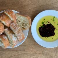 Ciabatta Bread · Garlic, parsley and chili flake dipping oil.